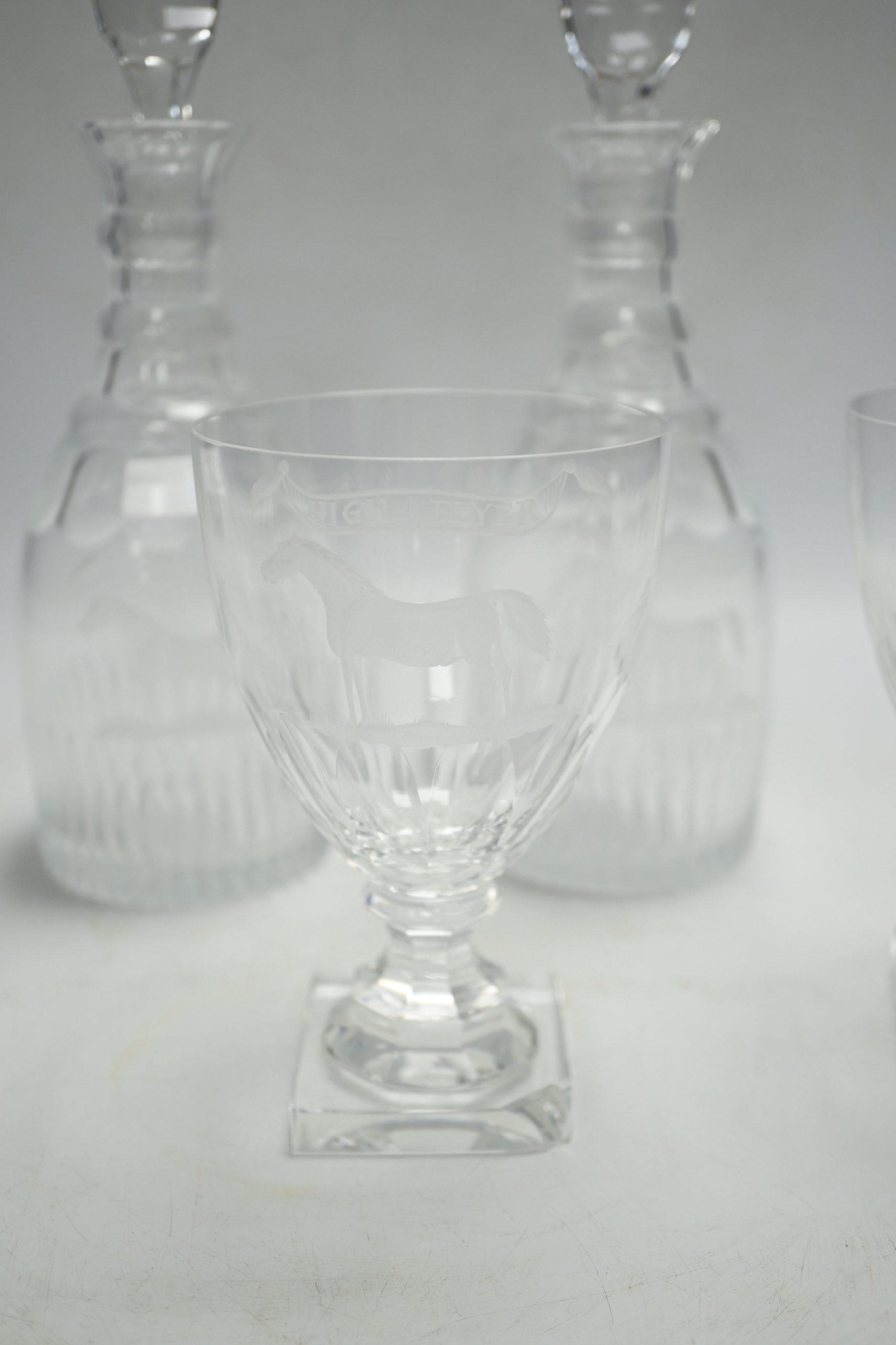 A suite of George III-style drinking glassware, consisting of a pair of decanters and stoppers and three square based rummers, each engraved with an image of the legendary racehorse, High Flyer, decanters 24.5cm, Please